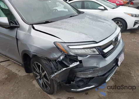 2021 Honda Pilot Elite from USA, damaged, VIN 5FNYF6H07MB057330